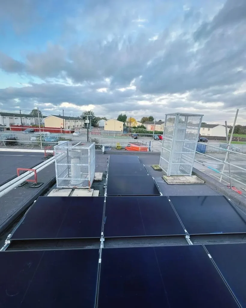 Flat rooftop solar panel installation with protective metal cages